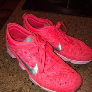 Coral Nike zoom athletic shoes